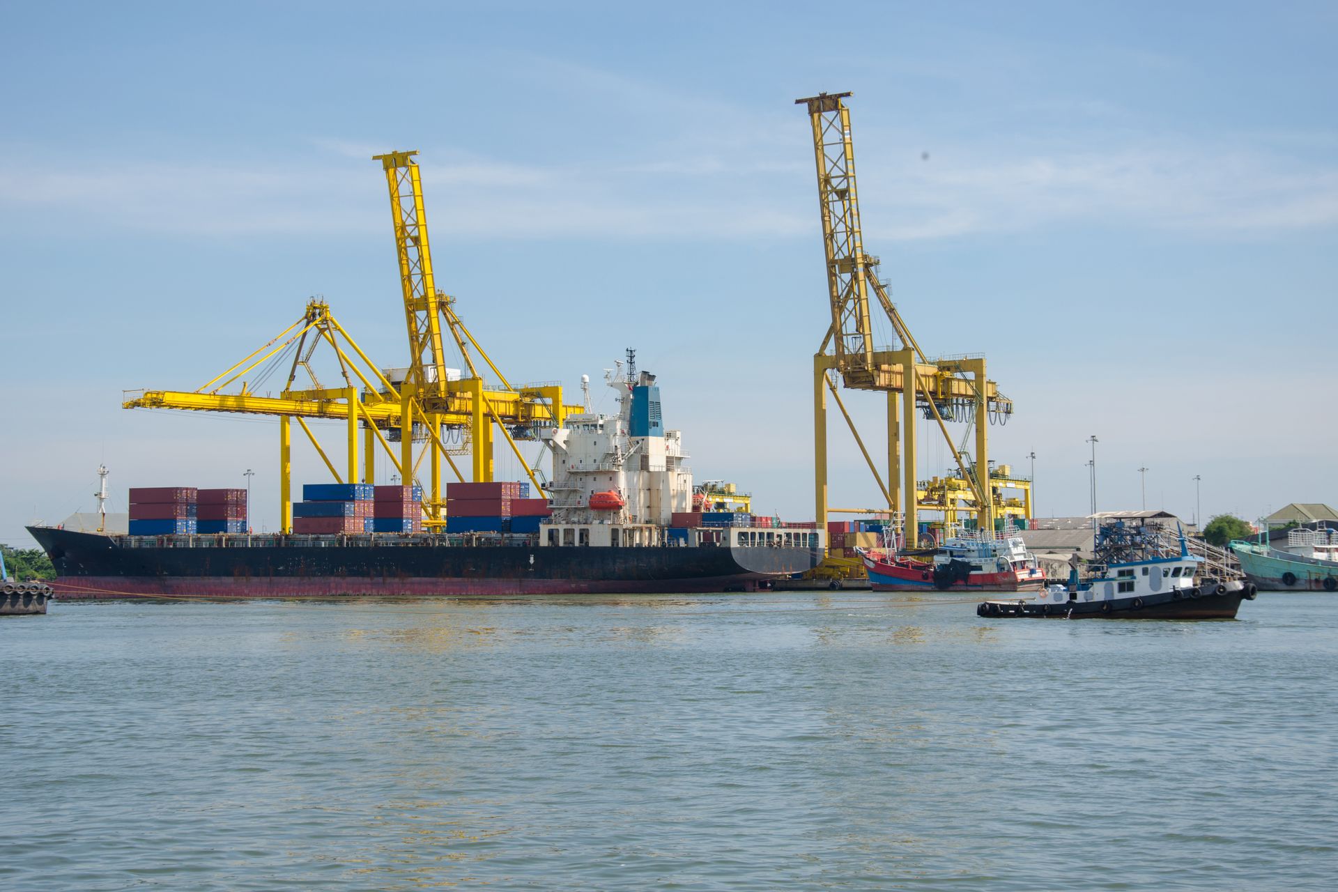 Container vessel and cranes at a West African port